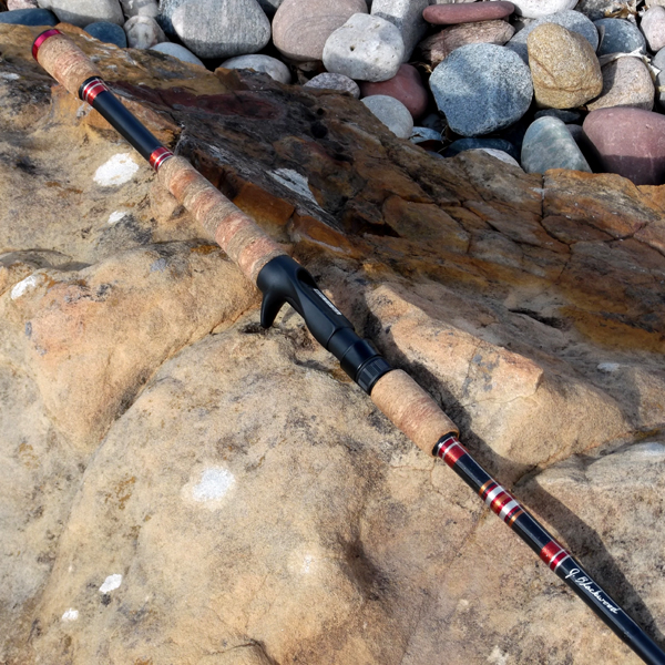 A Black Color Fishing Rod With Red Details
